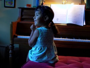 Tia Anna sharing her joy of music with Crystel. Crystel started lessons at 7 and took them for about 4 years.