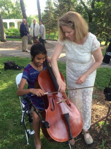 At the Wedding. Touching a Cello for the first time.